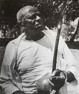 Mestre Bimba holding berimbau