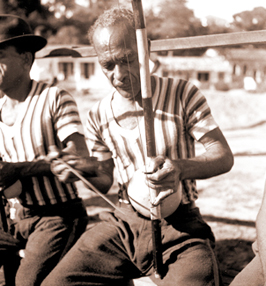 Mestre Pastinha playing berimbau